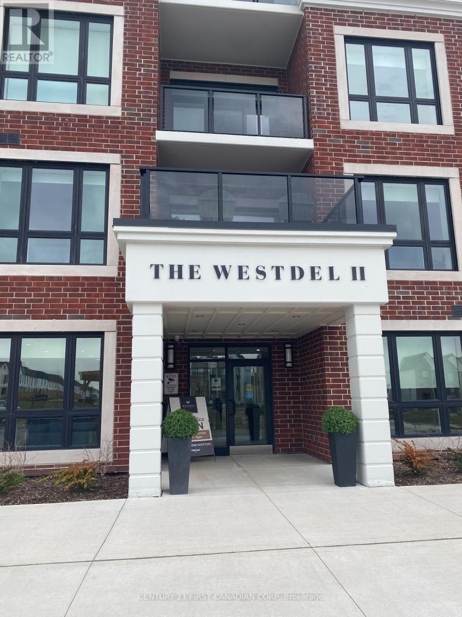 The Westdel II building has a white entrance with a black railing.