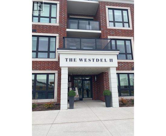 The Westdel II building has a white entrance with a black railing.