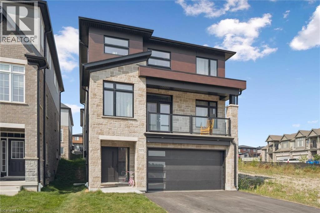 A modern two-story house with a garage is for sale.
