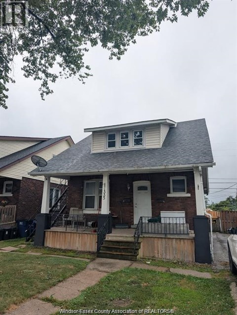 A house with a white door and a small porch.