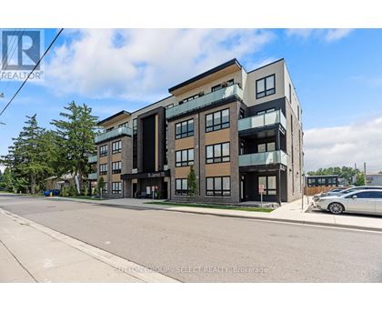 A modern multi-story building with a car parked in front.