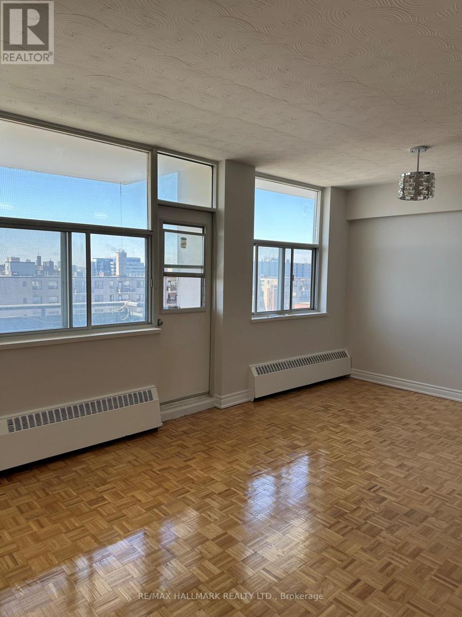 A room with a window and a radiator on the wall.
