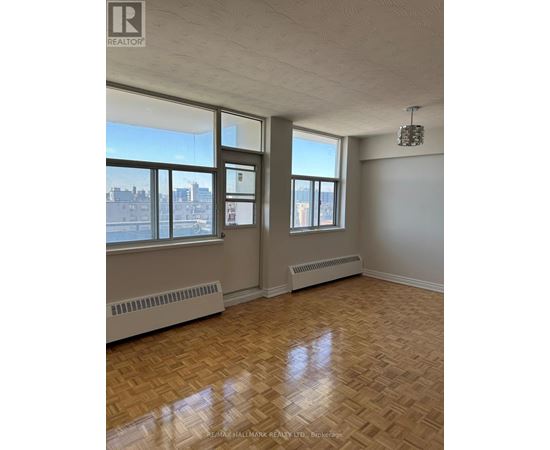 A room with a window and a radiator on the wall.