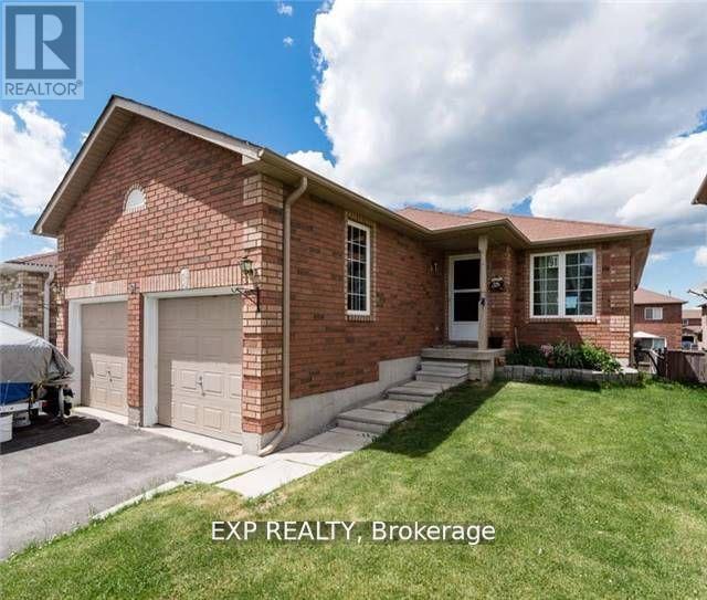 A brick house with a white garage door and a sign that says EXP REALTY Brokerage.