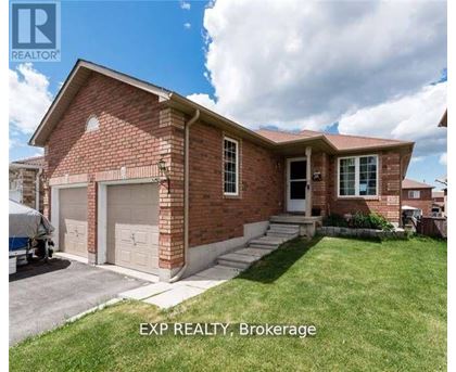 A brick house with a white garage door and a sign that says EXP REALTY Brokerage.