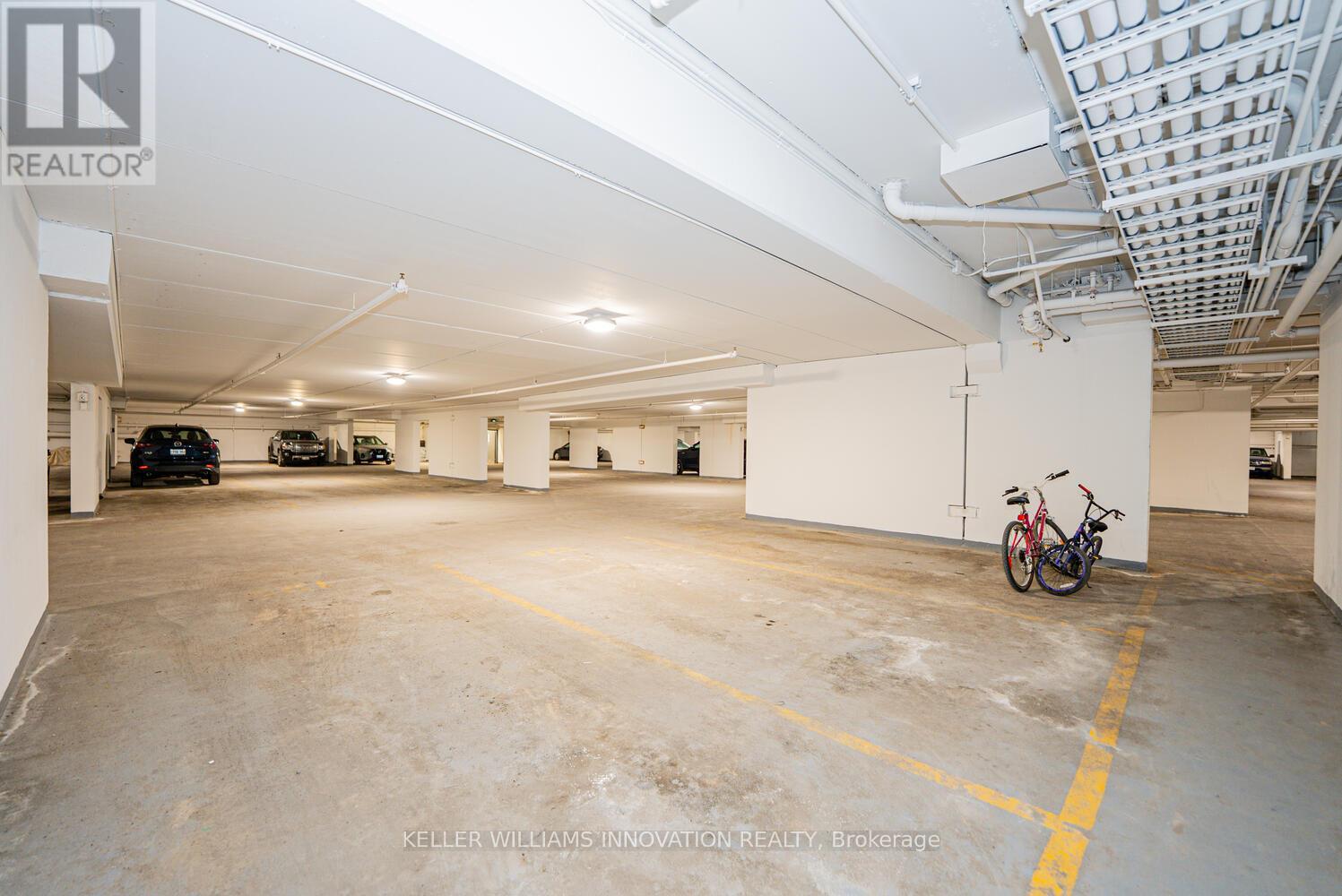 A spacious garage with a bicycle parked in the corner.