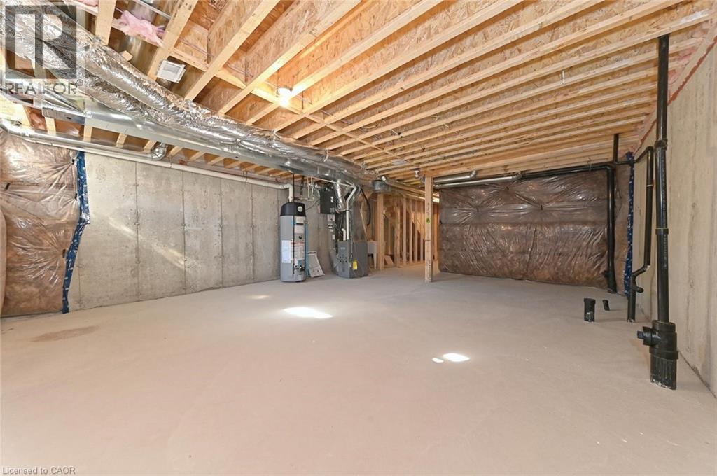 A spacious attic room with wooden beams and insulation.