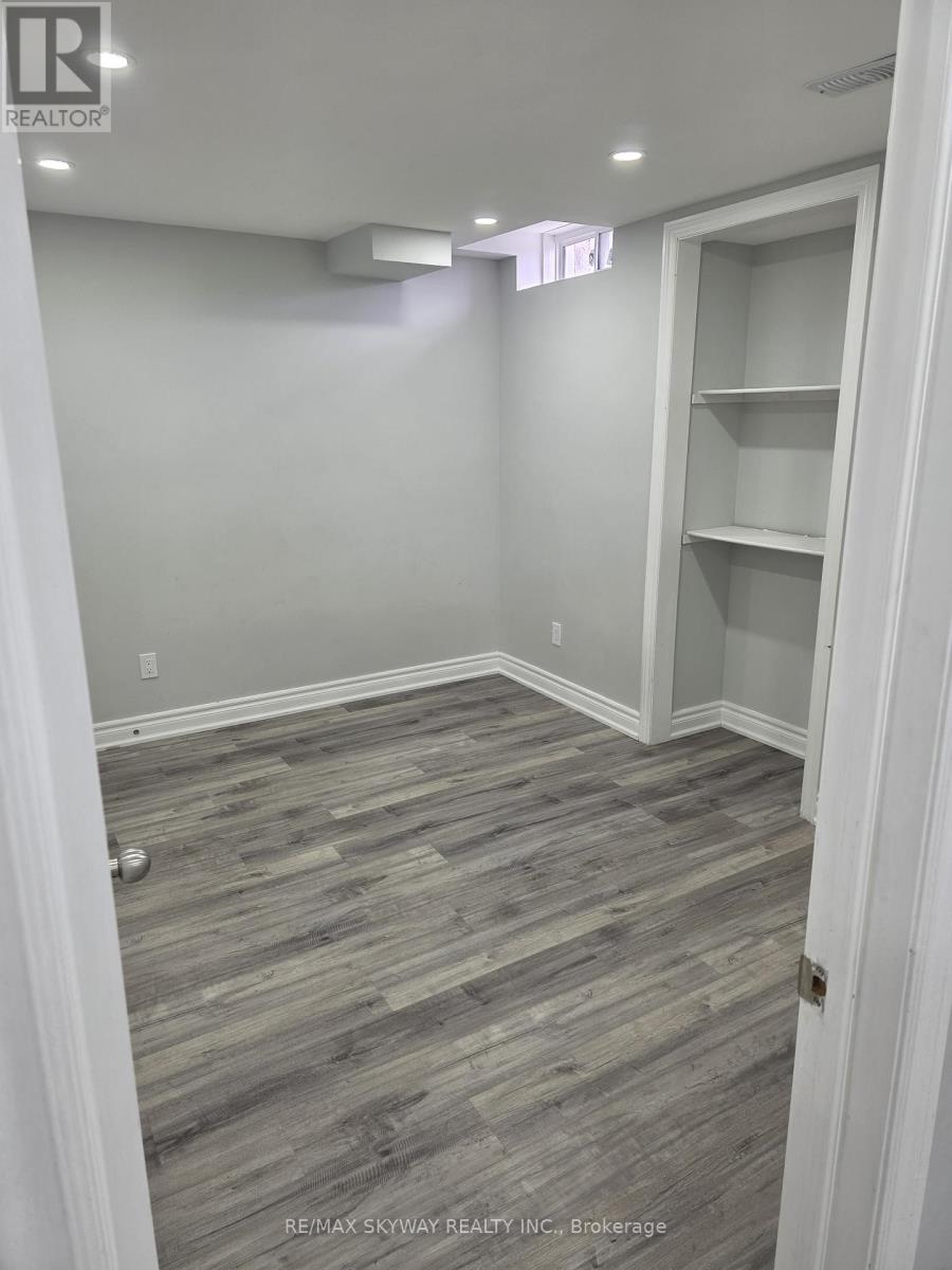 A room with a grey floor and white walls.