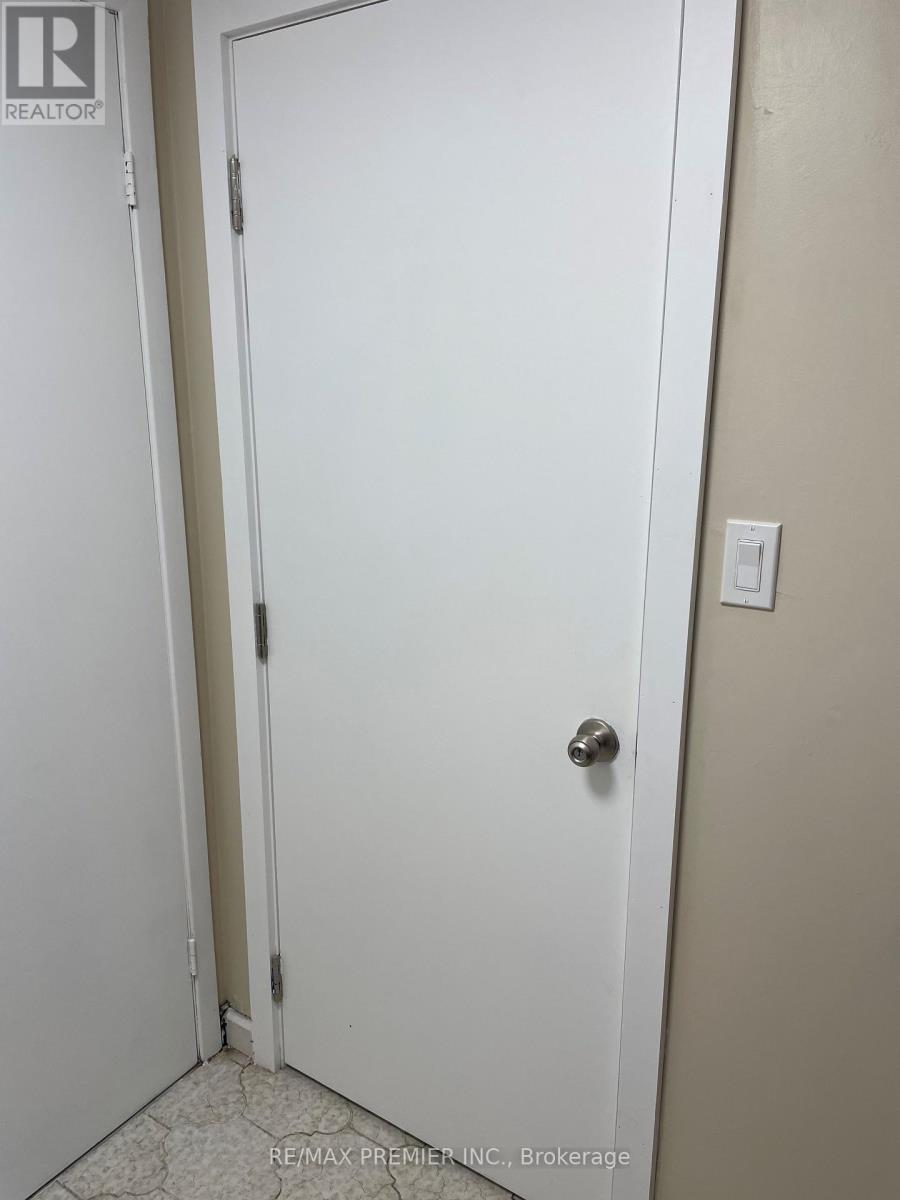 A white door with a silver handle in a room.