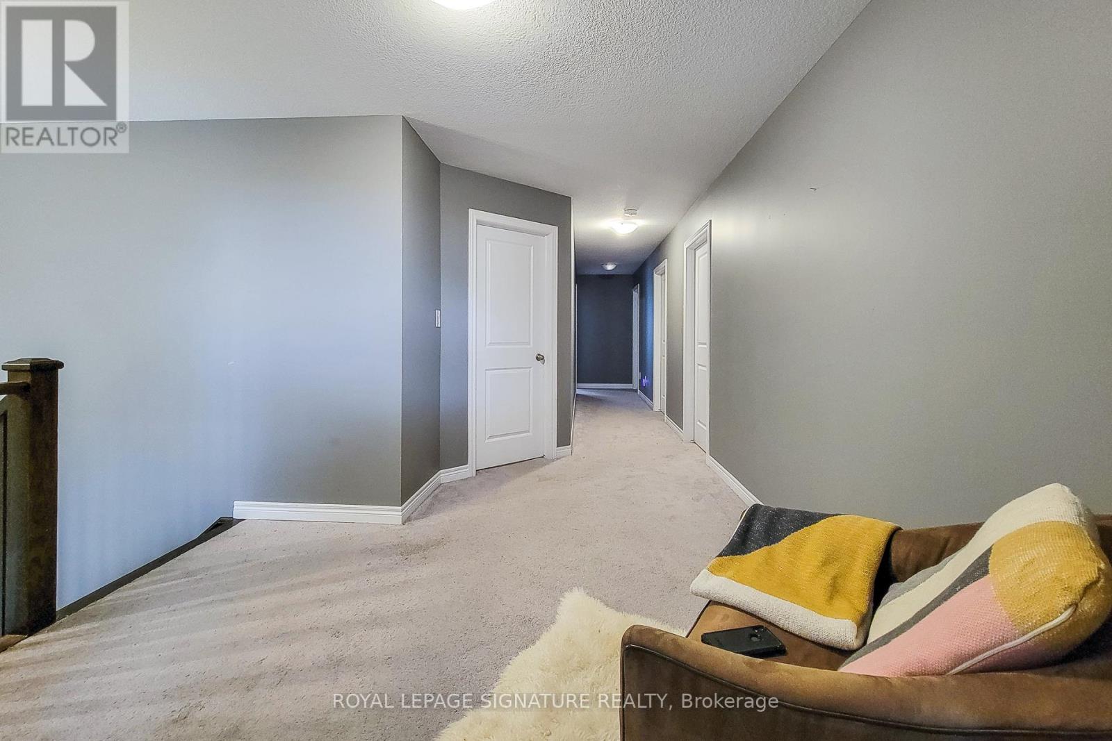 A living room with a couch and a chair.