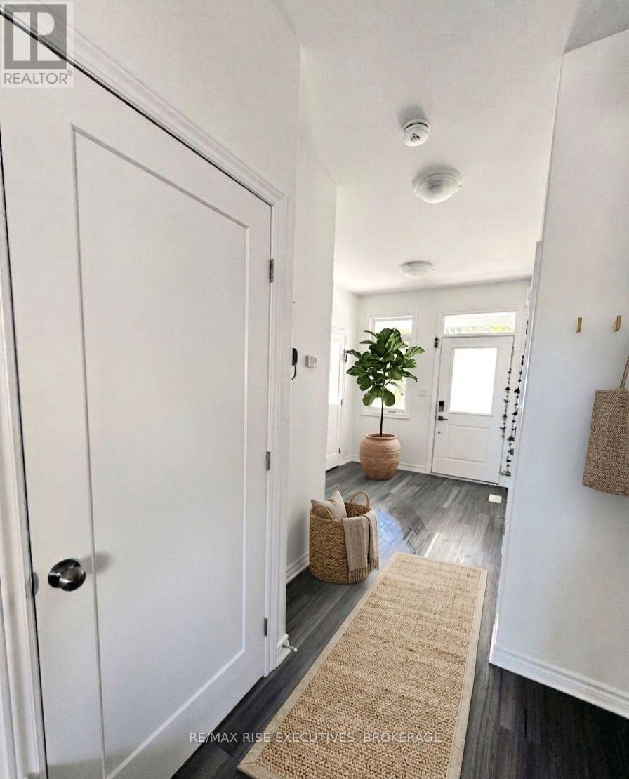 A hallway with a door on the left and a door on the right.