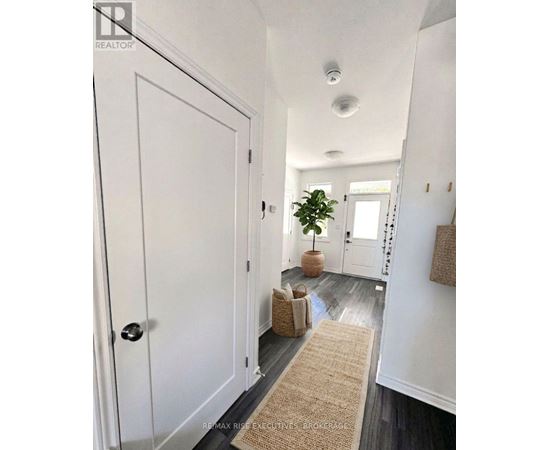 A hallway with a door on the left and a door on the right.