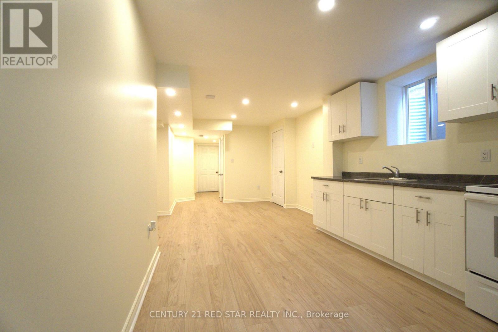 A realtor logo is on the top left corner of the image.