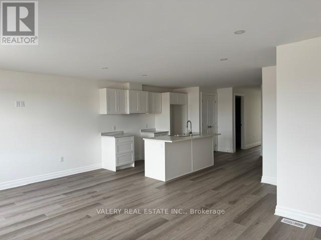 A real estate company is showcasing a kitchen area in a property.