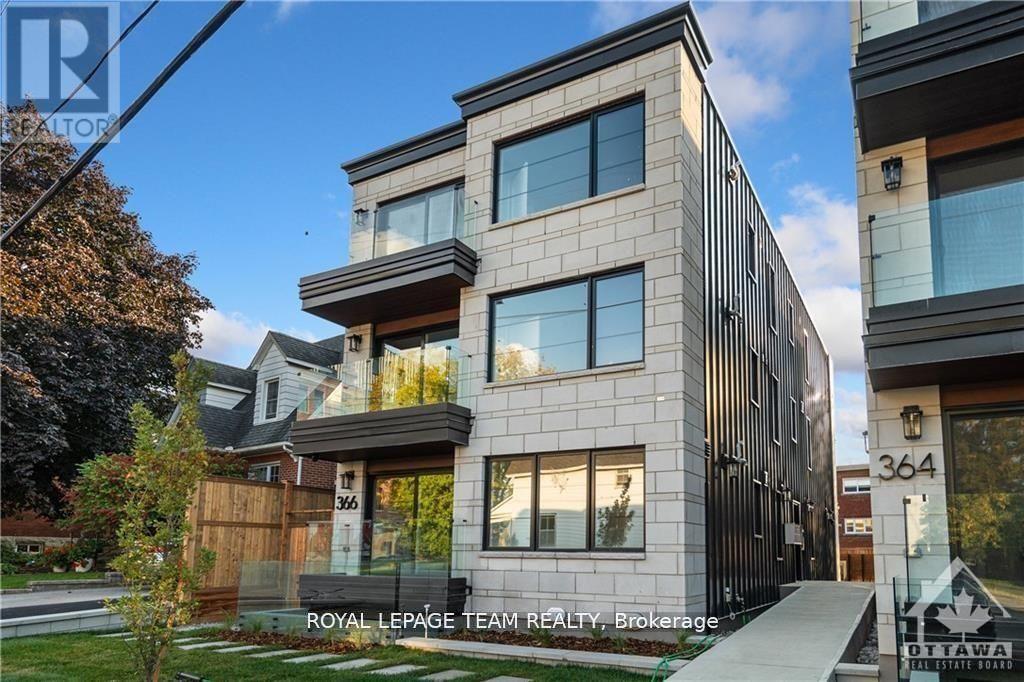 A modern multi-story building with the number 364 on it.