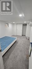 A bedroom with a bed and a mattress.