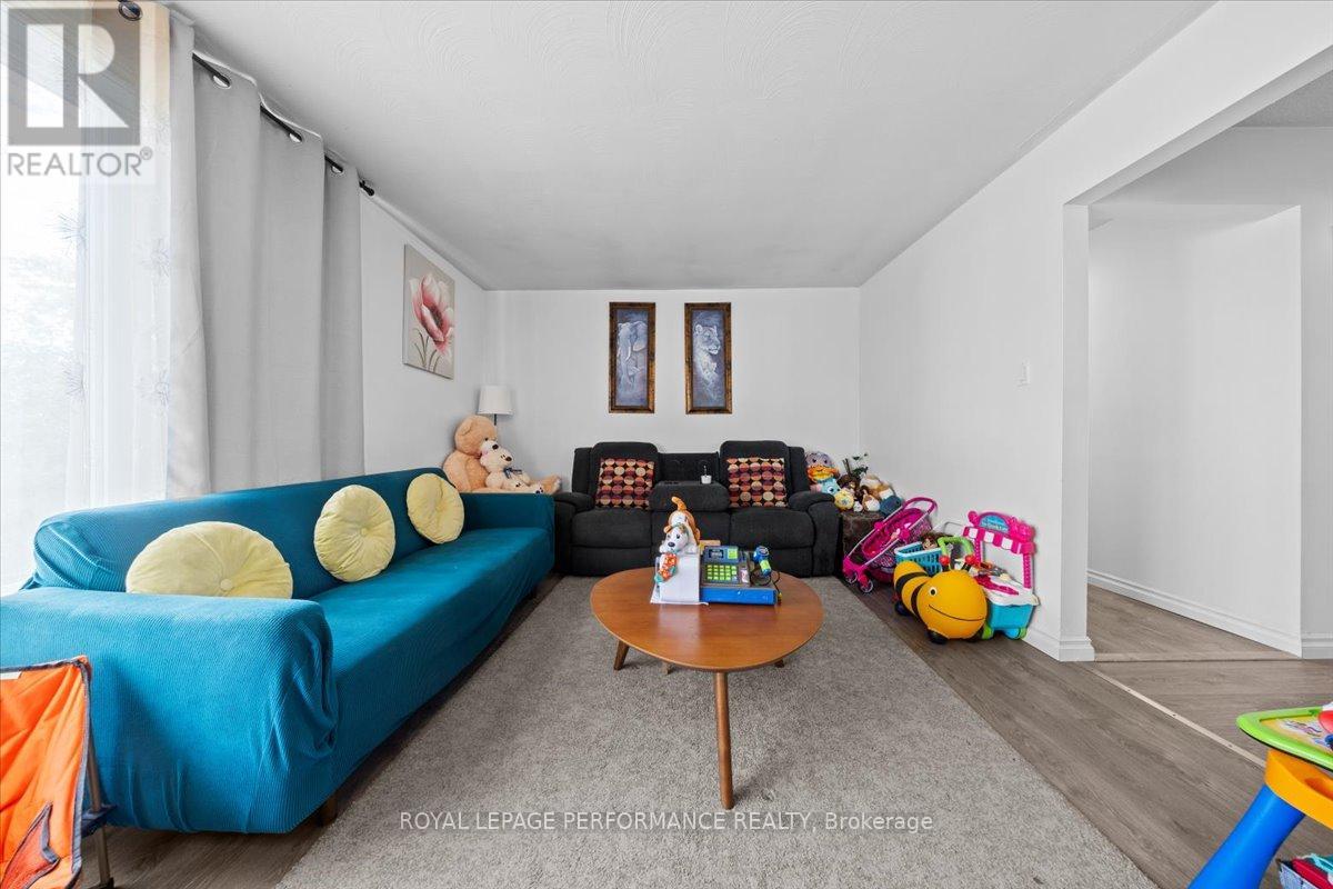 A living room with a blue couch and a coffee table.