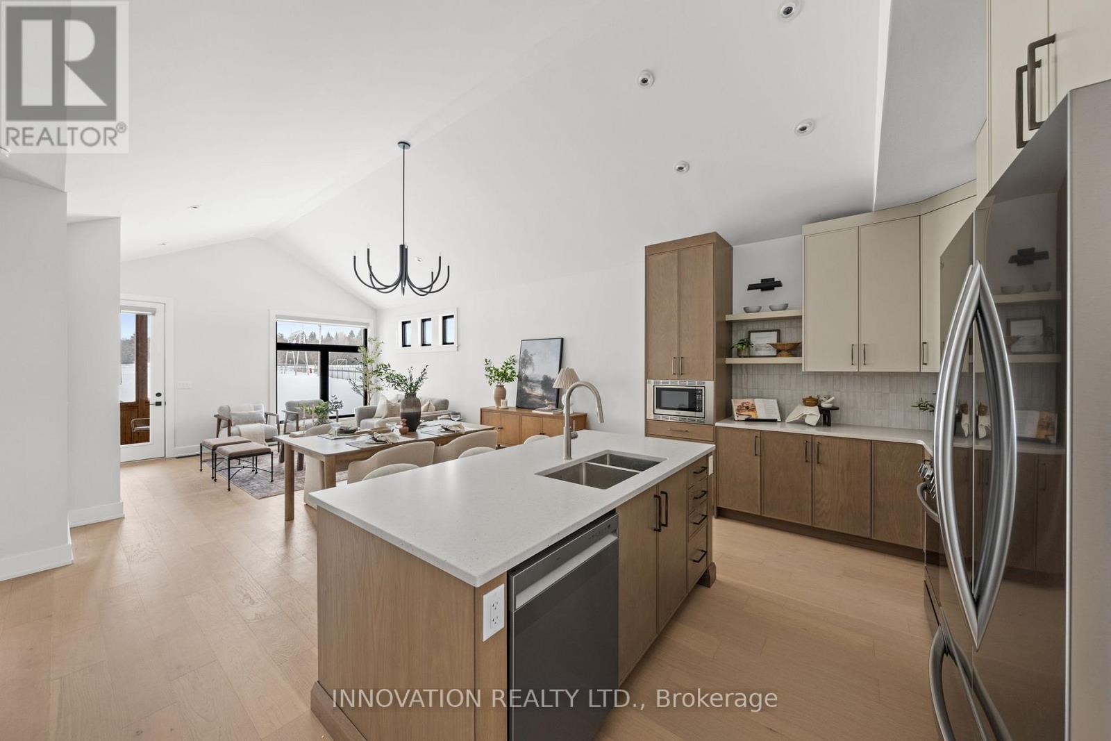 A modern kitchen with wooden cabinets and a large island.