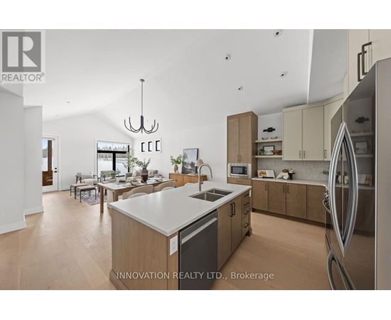 A modern kitchen with wooden cabinets and a large island.