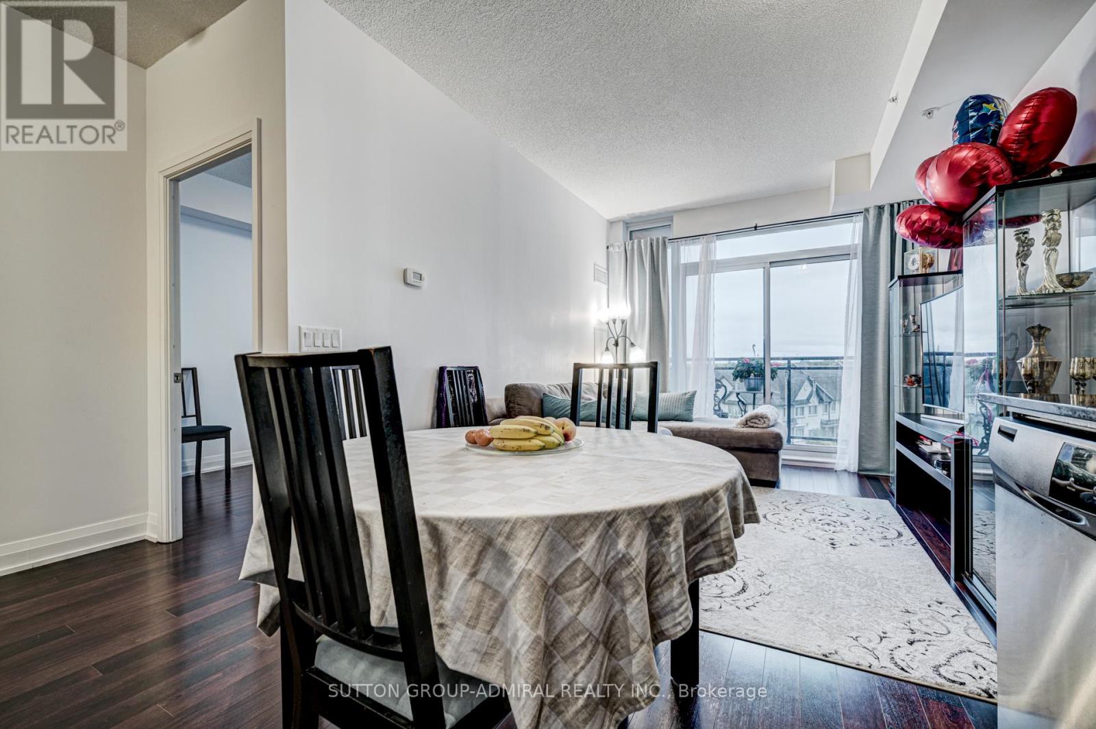 A dining room with a table set for two and a view of the ocean.
