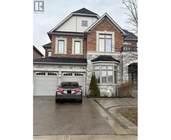 A house with a car parked in front of it.