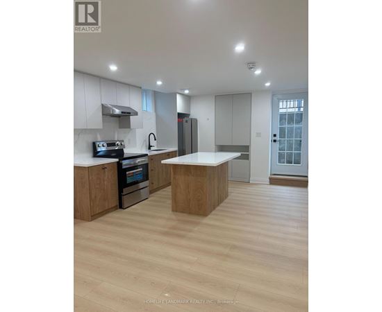 A modern kitchen with wooden cabinets and a central island.