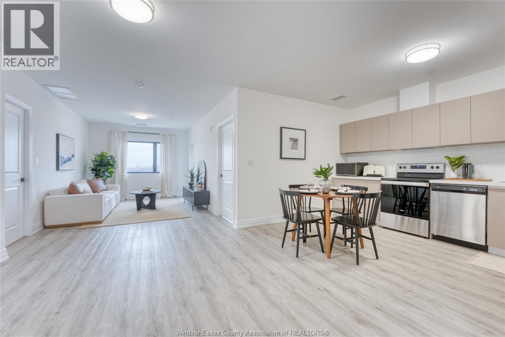 A well-lit, spacious kitchen and dining area with modern appliances and furniture.