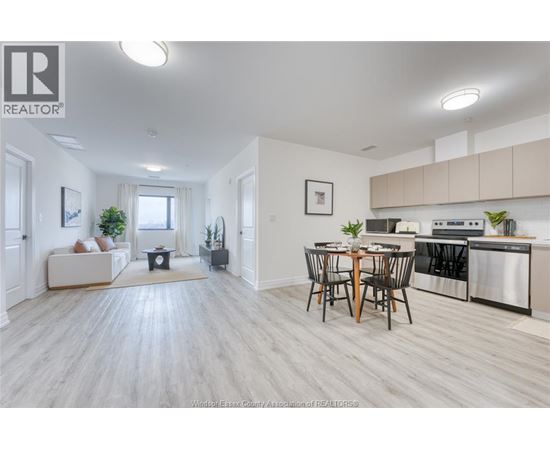 A well-lit, spacious kitchen and dining area with modern appliances and furniture.