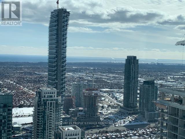A cityscape with a tall building under construction.