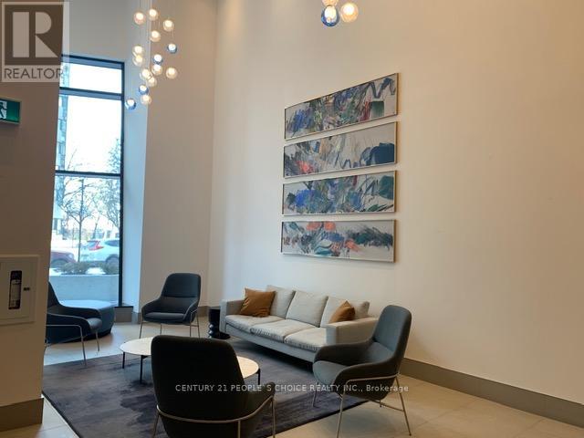 A living room with a sofa, chairs and a painting on the wall.