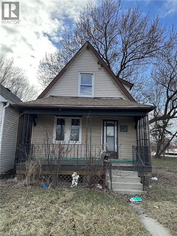 A house with a porch and a small yard.