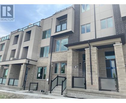 A building with a sign that says REALTOR in the upper left corner.