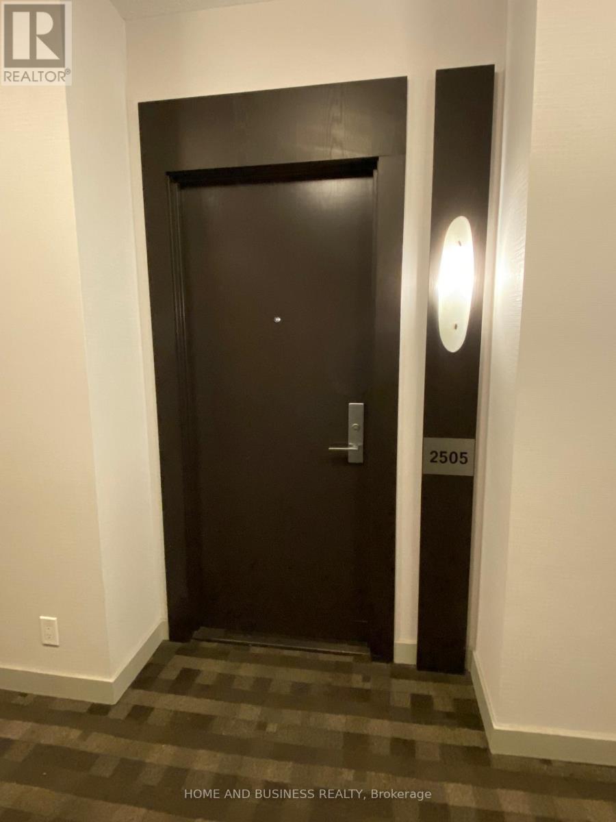 A black door with a number 2505 on it.