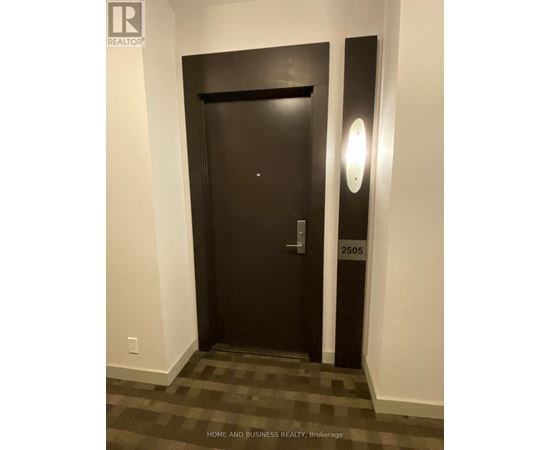 A black door with a number 2505 on it.