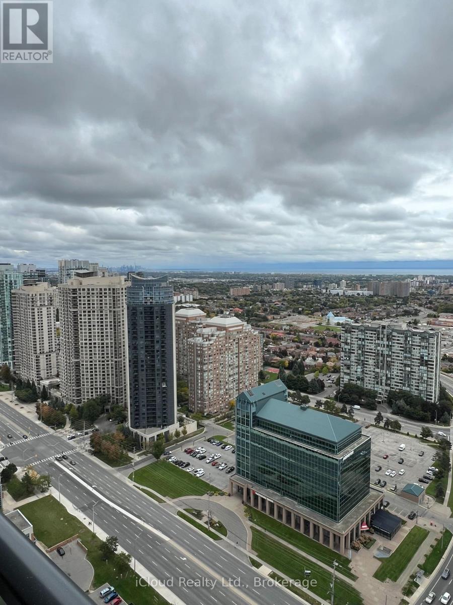 A cityscape with a realtor logo in the corner.