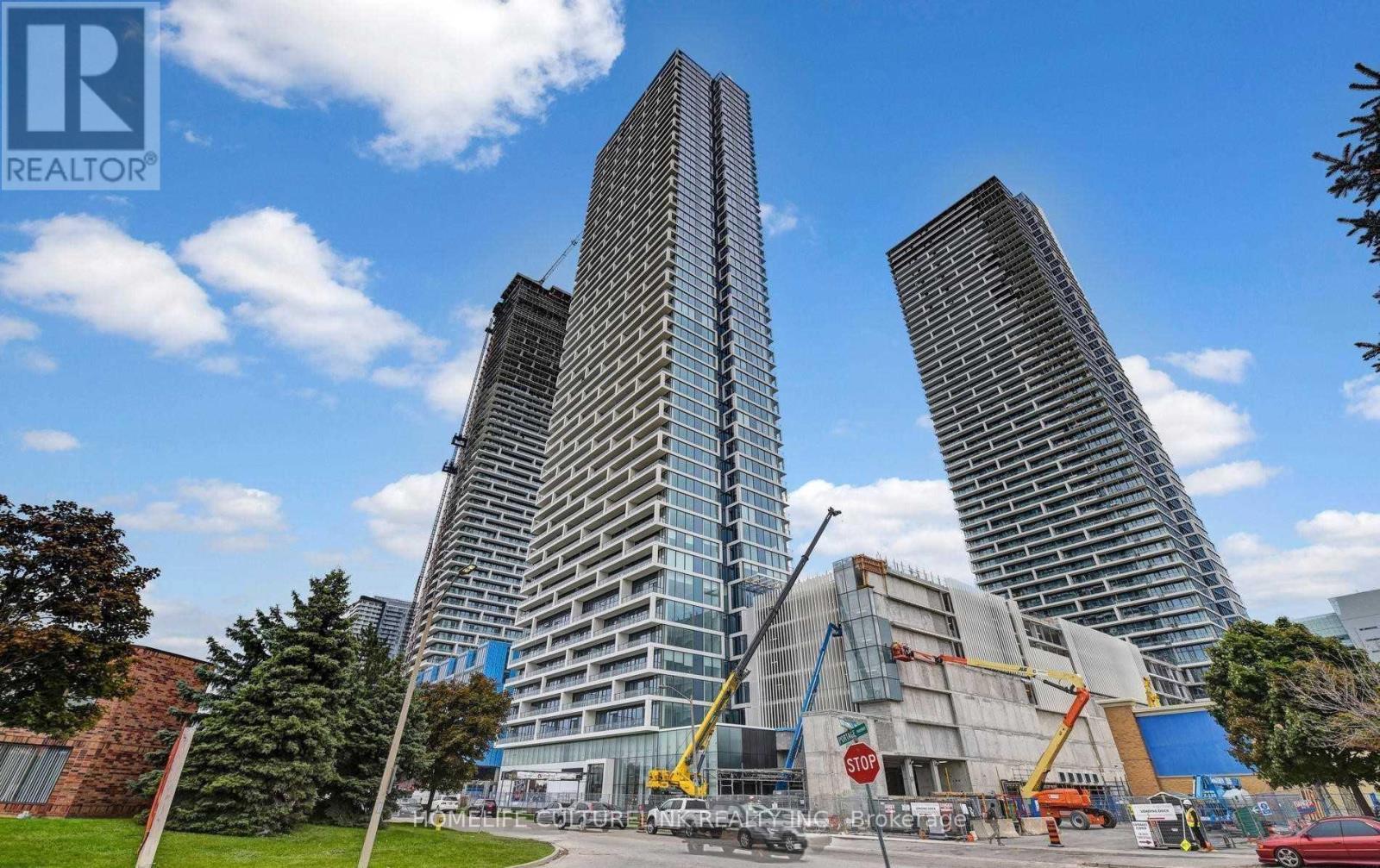 A construction site with a large building under construction in the background.