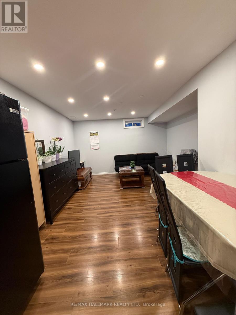 A bedroom with a bed, dresser, and chest of drawers.