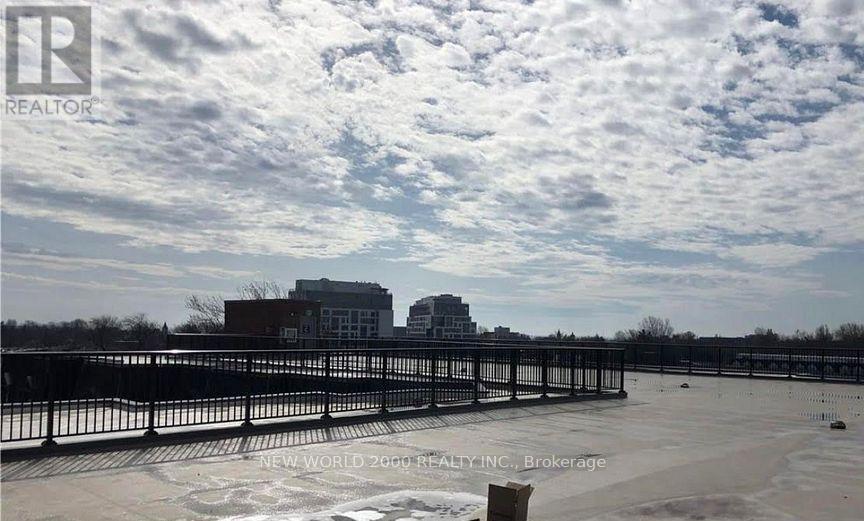 A real estate company is advertising a property with a large open space and a building in the background.
