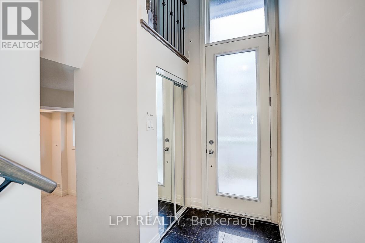 A white door with a glass window is in a room.