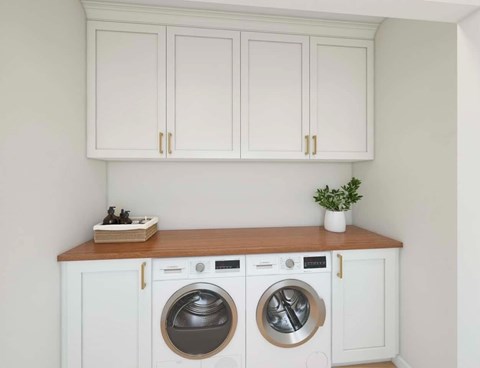 A small laundry room with a washer and dryer.