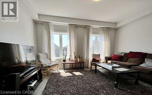 A living room with a piano, sofas and a coffee table.