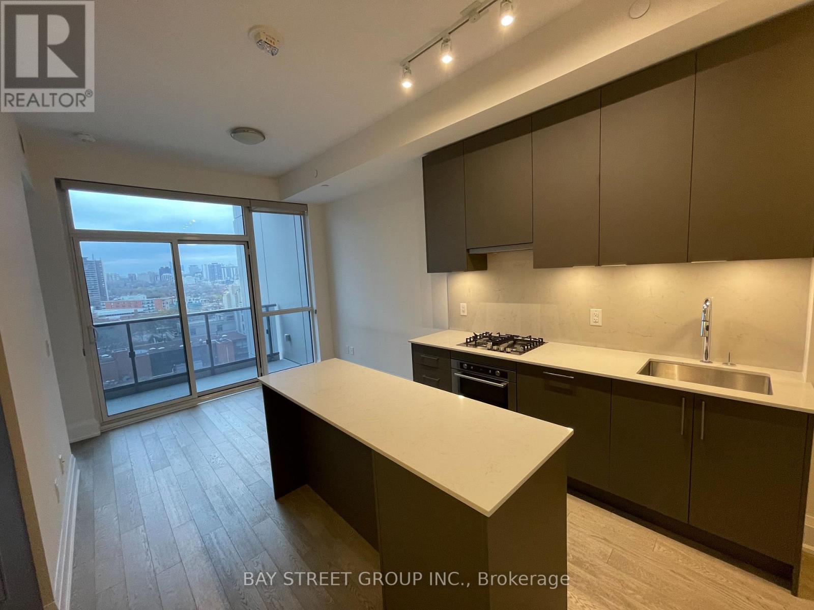 A kitchen with a stove top oven and a counter top.