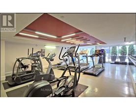 A gym with treadmills and exercise bikes.