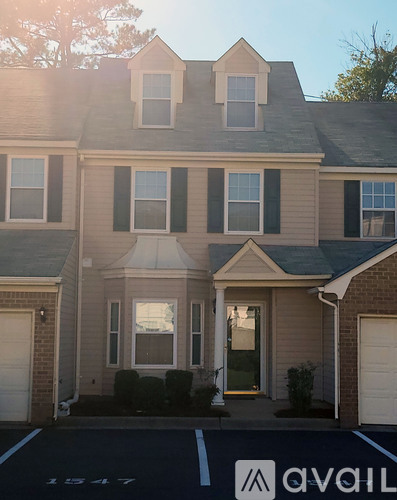 A house with a garage door that says Avail.