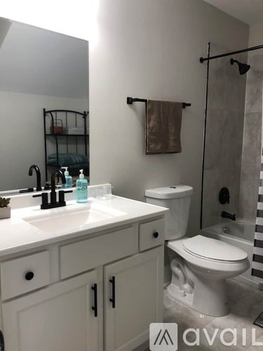 A bathroom with a white toilet and sink.