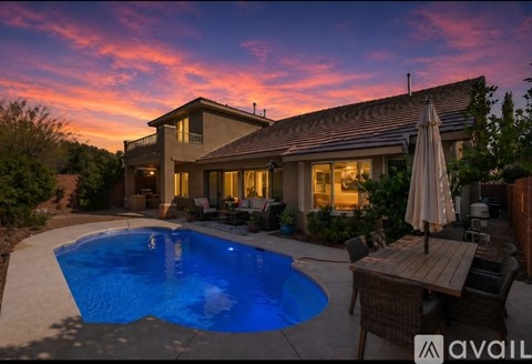 A house with a pool in the backyard.