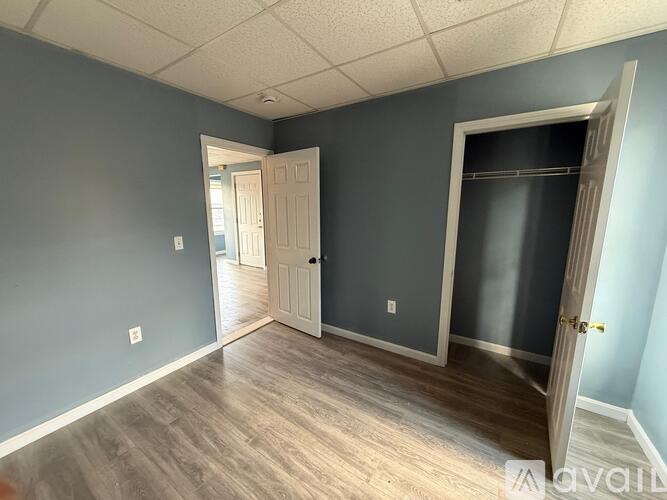 A room with a door on the right and another door on the left.