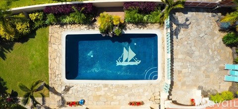 A small pool with a sailboat design in the middle.