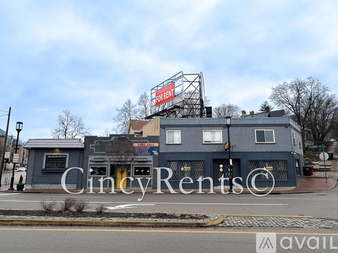 A building with a sign that says "Cincy Rents" in front of it.