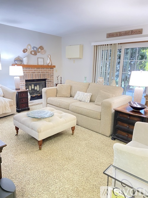 A living room with a fireplace and a couch.